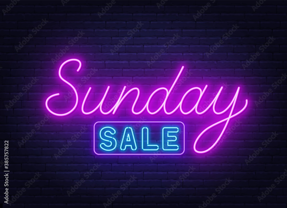 Sunday Sale neon sign on brick wall background .