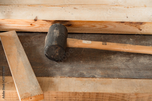 Carpenter's hammer and wood material.