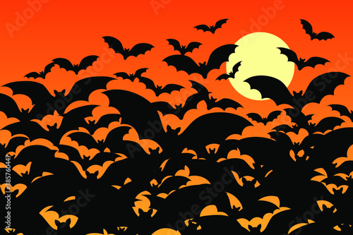 Silhouttes of a flock of spooky halloween bats filling a full moon orange night sky