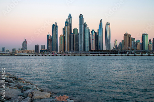 View of A Dubai Marina during sunset hour. Shot made from Palm Jumeirah, man made island. Dubai, UAE.