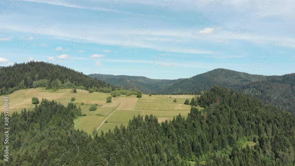 Flying over mountain Wierch, near village Lomnica-Zdroj. Beskid Sadecki, Poland. Flying over mountain Wierch, near village Lomnica-Zdroj. Beskid Sadecki, Poland.