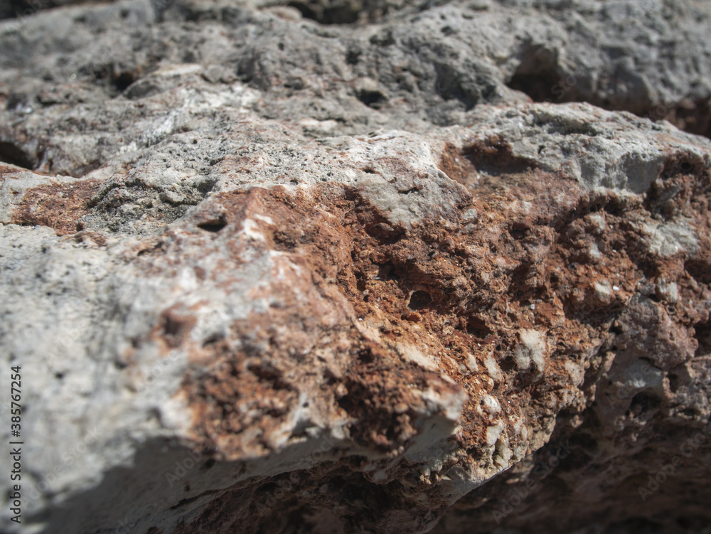 Textured rough hard natural rock closeup detail Textured rough hard natural rock closeup detail