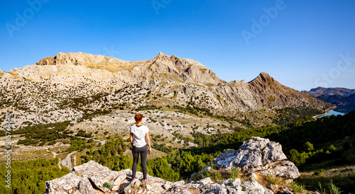 woman stand on view to mountains
