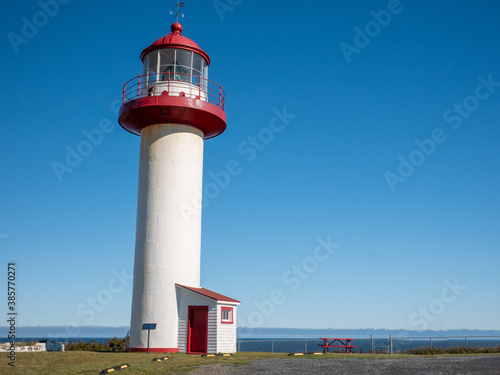 Stunning old lighthouse with a blue sky as a background