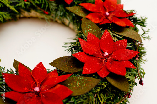Festive background with an Advent wreath. Christmas lights. Handmade decoration.