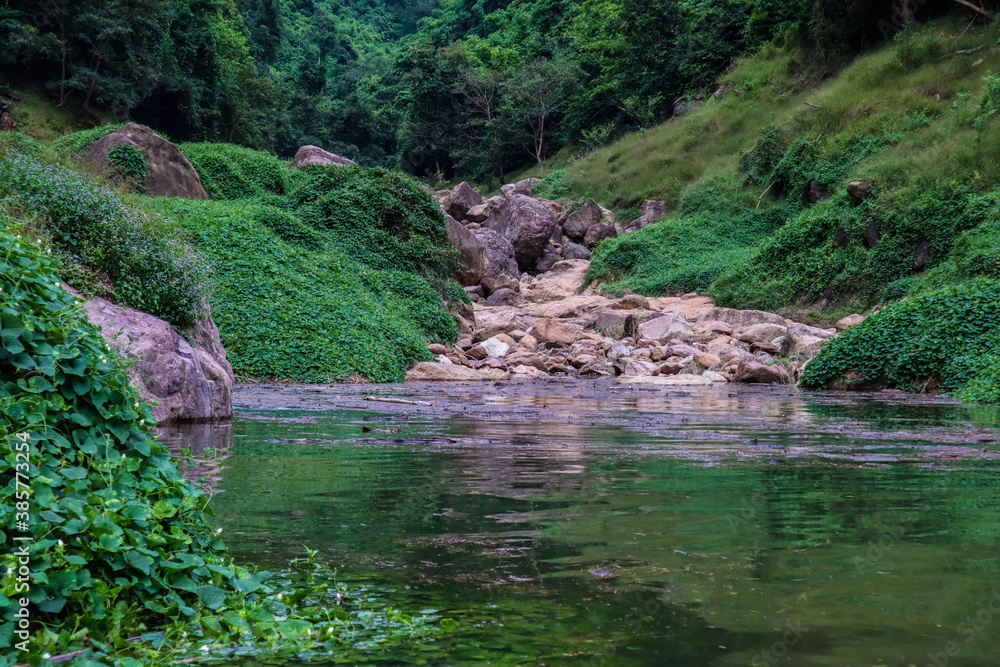 River flows over rocks in this beautiful scene River flows over rocks in this beautiful scene