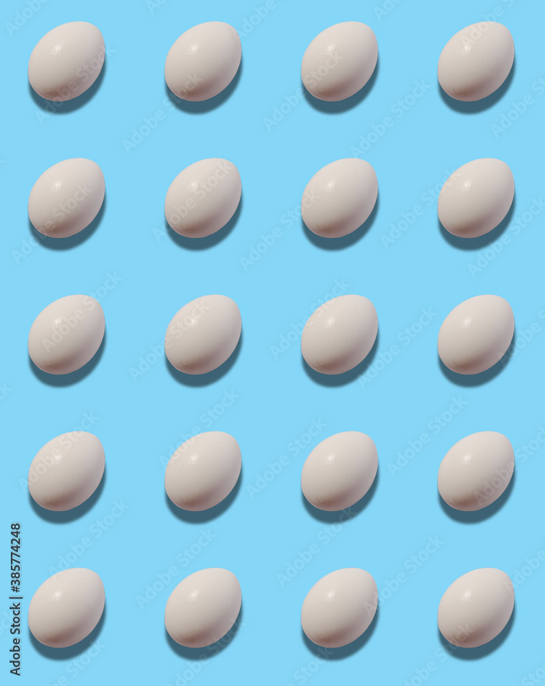 Group of chicken eggs on pastel blue background. Group of chicken eggs on pastel blue background.