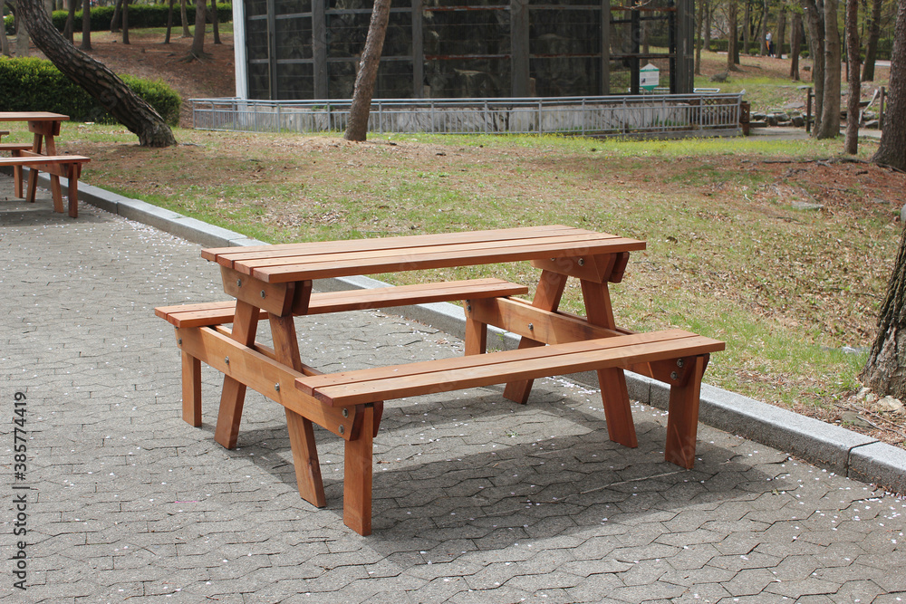 Wooden bench and table in the park Wooden bench and table in the park