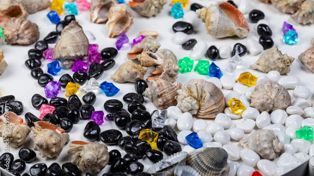 Bright background of their colored stones and seashells Bright background of their colored stones and seashells