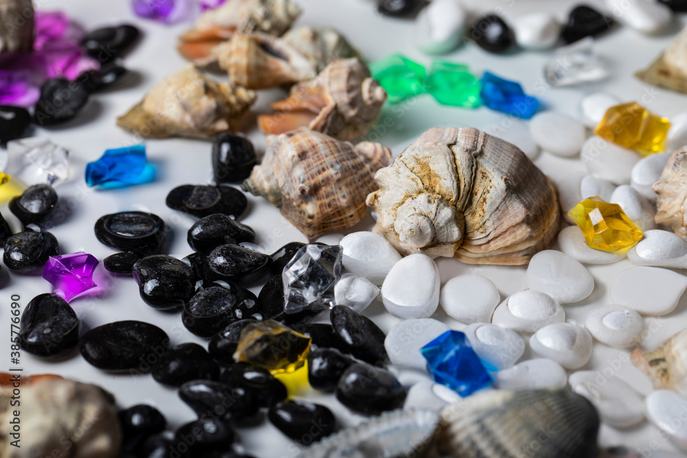 Bright background of their colored stones and seashells. Bright background of their colored stones and seashells.