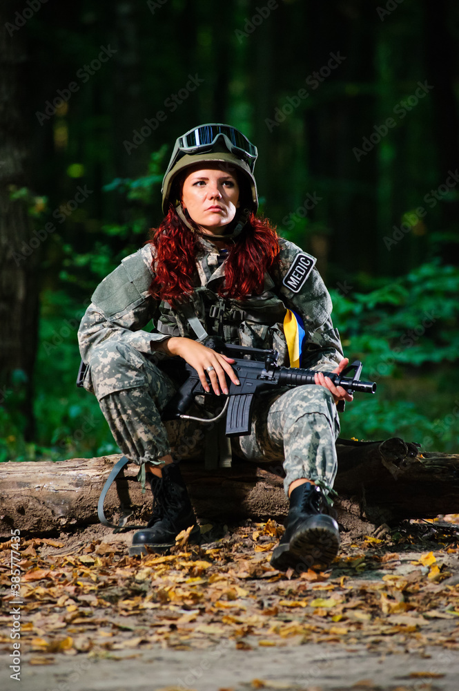 Female soldier in the forest