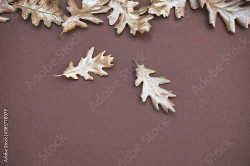 Golden colored leaves on dark background