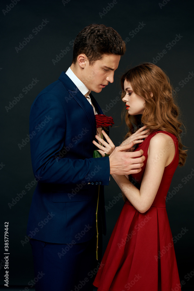 luxury couple hug romance relationship rose over dark isolated background luxury couple hug romance relationship rose over dark isolated background