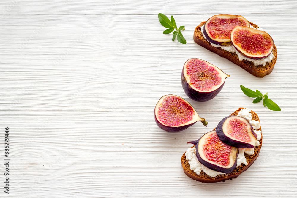 Canape or sandwich with figs and cheese, overhead view