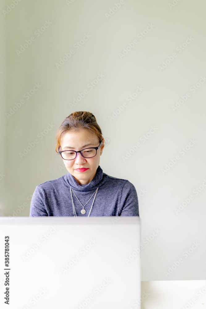 Young asian businesswoman using computer at home office workplace, happy korean employee working on laptop, attractive japanese or chinese woman student studying communicating online with pc Young asian businesswoman using computer at home office workplace, happy korean employee working on laptop, attractive japanese or chinese woman student studying communicating online with pc