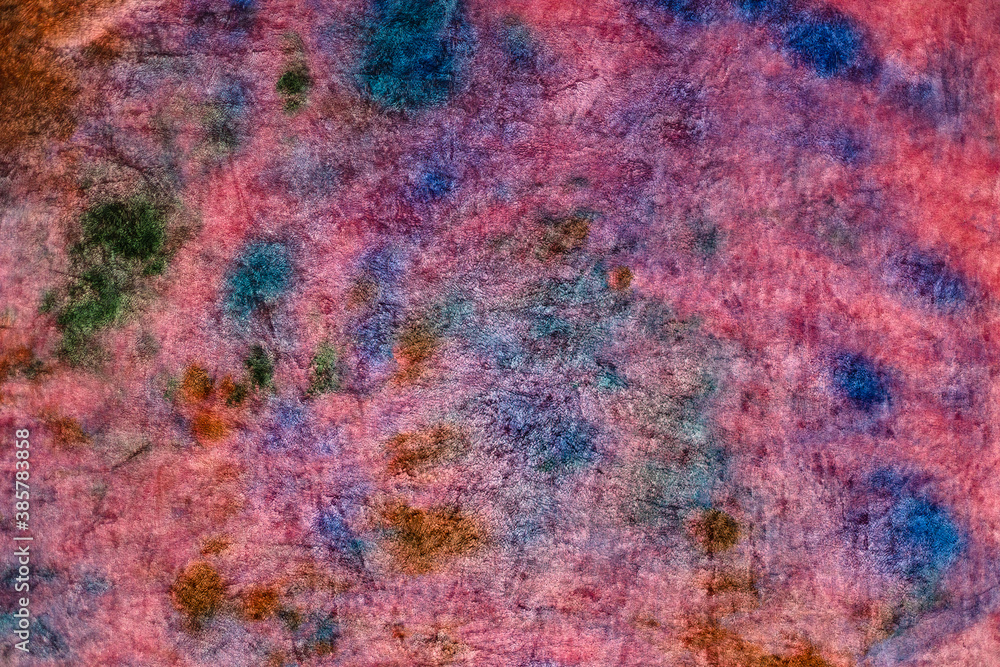 textile background - pink velvet stained in tie-dye abstract batik technique textile background - pink velvet stained in tie-dye abstract batik technique