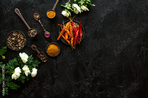 Fototapeta Naklejka Na Ścianę i Meble -  Cooking utensils and hot spices in metal bowls and spoons. Top view