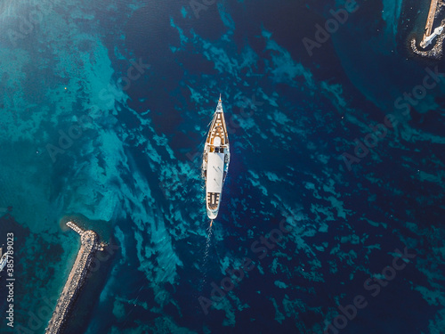 Aerial top view of CGN's boat shot using a drone over the Leman Lake and its textures in Geneva, Switzerland. Vue aérienne du bateau de la CGN au dessus du lac leman, Genève, Suisse.
