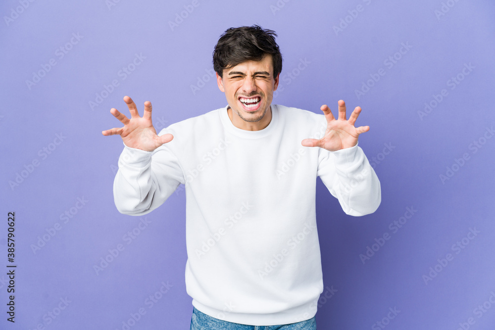 Young cool man upset screaming with tense hands. Young cool man upset screaming with tense hands.