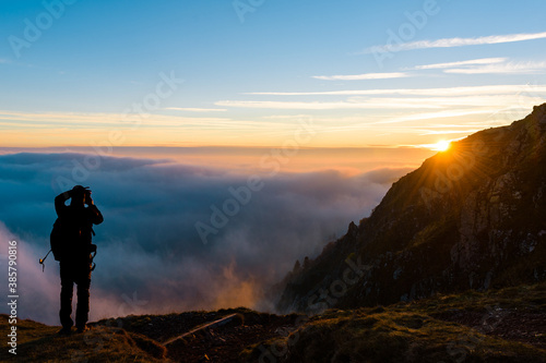 silhouette of a person in the mountains