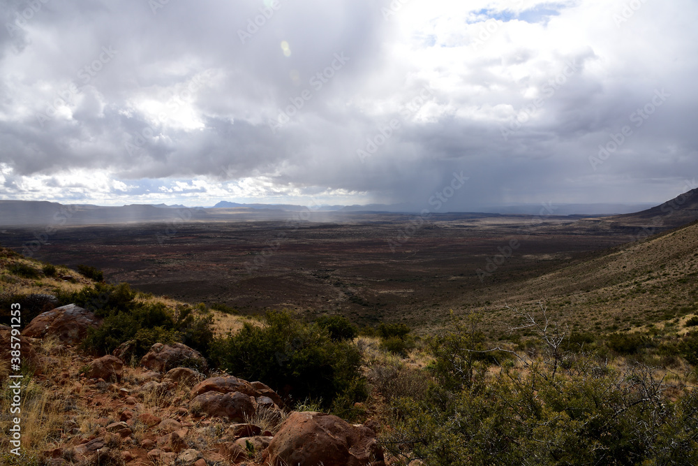 A burst of rain in the arid semi-desert Karoo landscape in South Africa