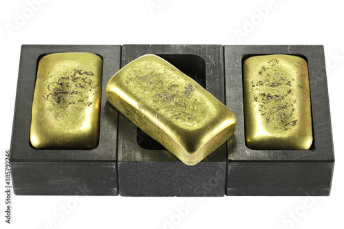 graphite molds with gold bars isolated on white background