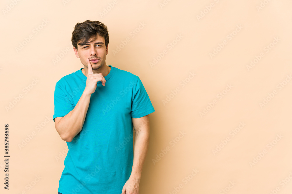 Young cool man looking sideways with doubtful and skeptical expression. Young cool man looking sideways with doubtful and skeptical expression.