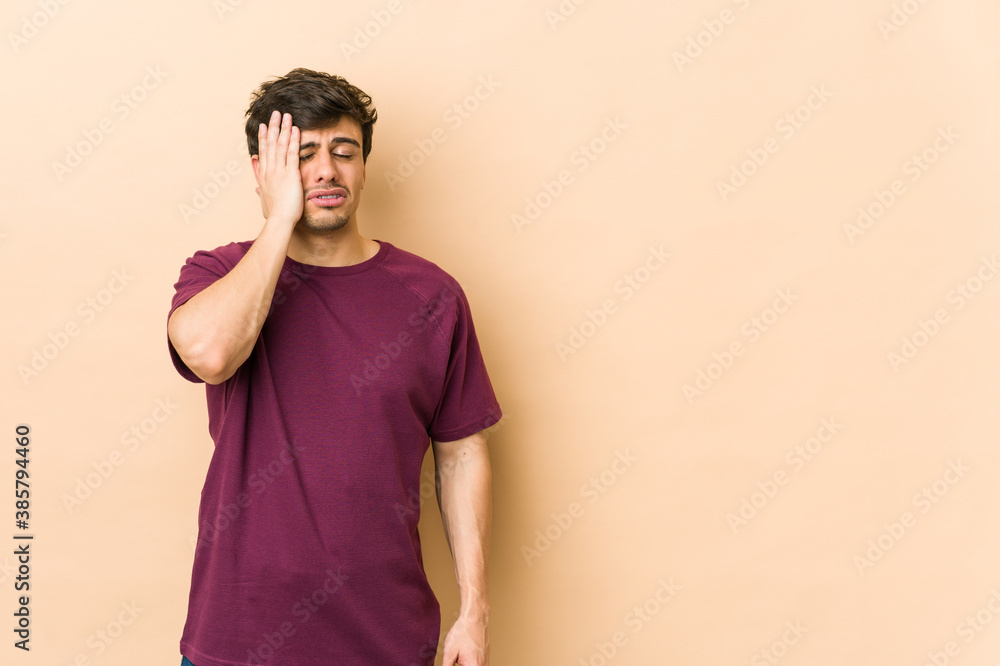 Young cool man tired and very sleepy keeping hand on head. Young cool man tired and very sleepy keeping hand on head.