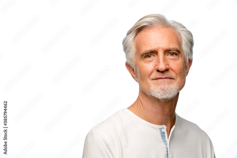 Portrait of middle aged white man with grey hair looking at camera with straight face Portrait of middle aged white man with grey hair looking at camera with straight face