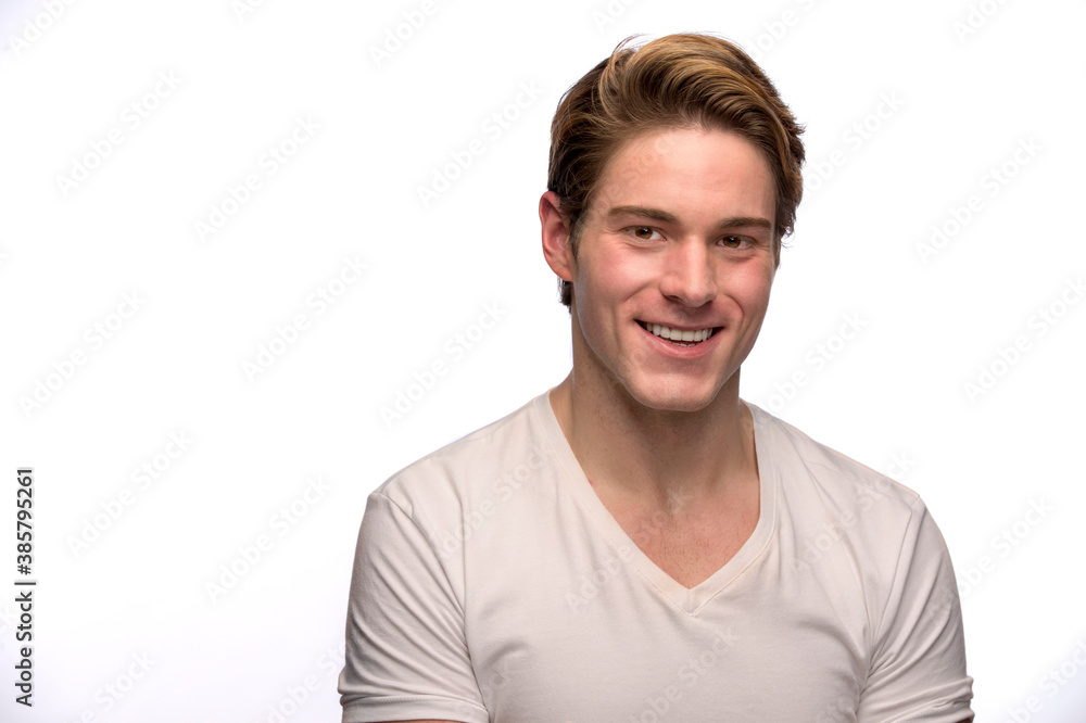 Portrait of young Caucasian man looking at camera smiling Portrait of young Caucasian man looking at camera smiling