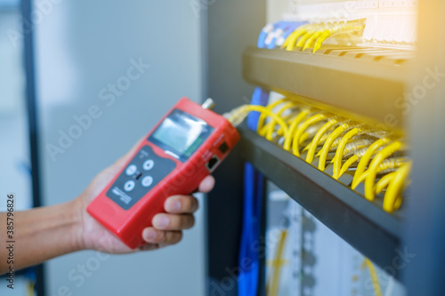 Φωτογραφία Network tester tools and system administrators will test the network cable in technogy data center room