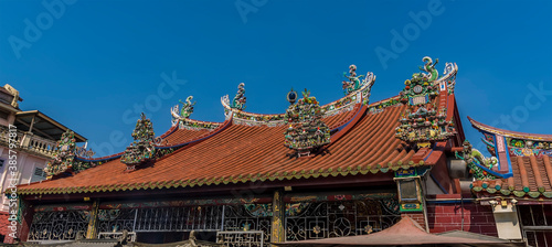 Elaborate roof decorations on a Chinese temple on Penang Island  Malaysia  Asia