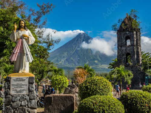 Mayon volcano - massive, very active and perfect cone shape volcano and Cagsawa ruins in Legazpi, Albay, Luzon, Philippines  photo