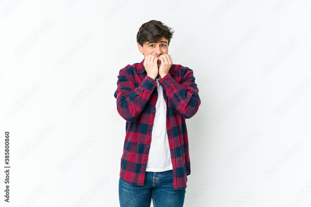 Young cool man biting fingernails, nervous and very anxious. Young cool man biting fingernails, nervous and very anxious.