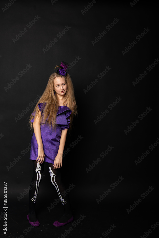 Teenage girl on black background of Halloween Teenage girl on black background of Halloween