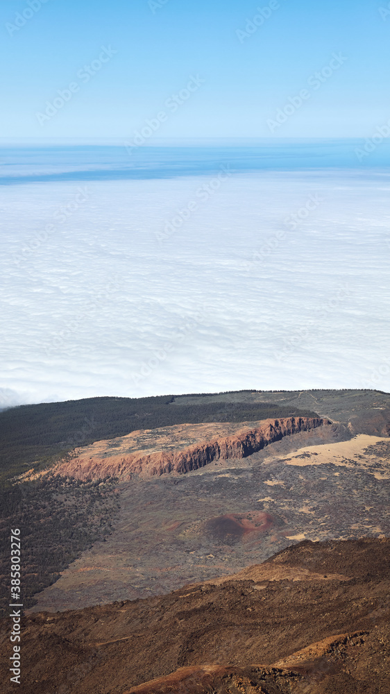 View from Teide Volcano with clouds above the ocean, Tenerife, Spain.