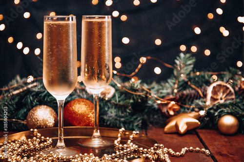 Two glasses of cold champagne in a Christmas atmosphere