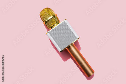 Studio shot of golden microphone