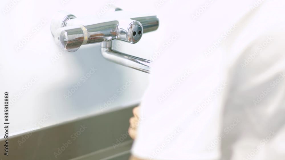doctor surgeon washes and disinfects hands before surgery doctor surgeon washes and disinfects hands before surgery