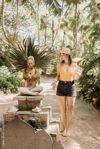 Female tourist holding hands like a statue photo