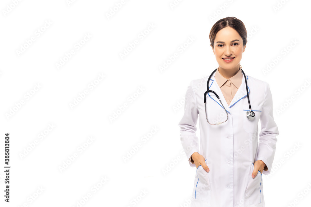 Doctor with stethoscope smiling at camera isolated on white Doctor with stethoscope smiling at camera isolated on white
