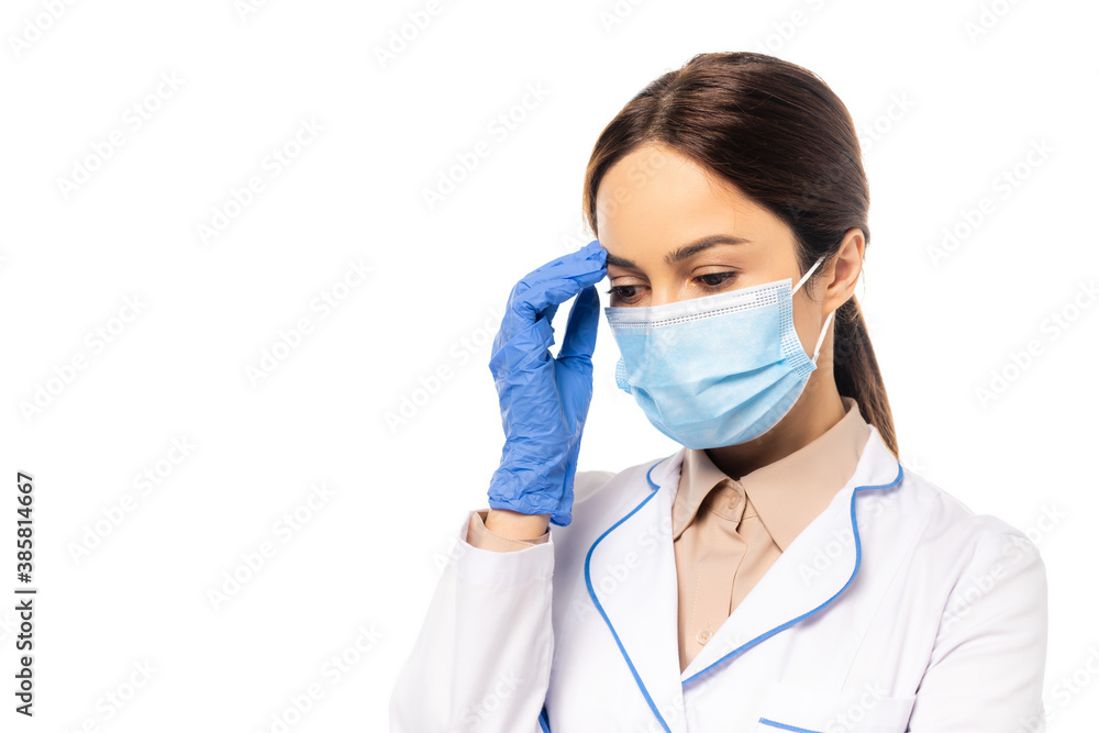 Doctor in medical mask and latex glove touching forehead isolated on white Doctor in medical mask and latex glove touching forehead isolated on white