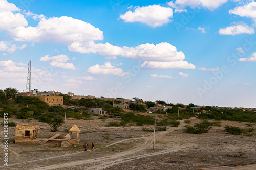 a beautiful view of blue clouds and a village from  Amarsagar temple jaisalmer,rajasthan,india photo