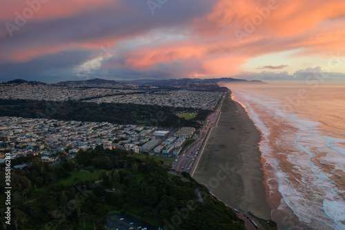 High angle view of sunset over cityscape and coastline