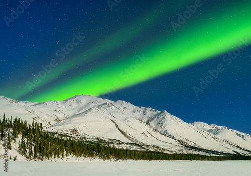 Aurora Borealis over mountains of Brooks Range