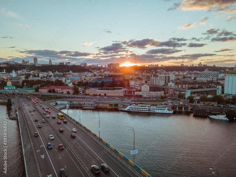Naklejka premium Aerial view of the big city at sunset