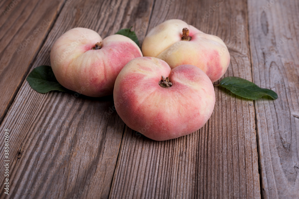 Fresh sweet fig peaches on wooden background Fresh sweet fig peaches on wooden background
