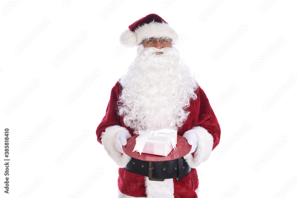Senior man in traditional Santa Claus costume holding white wrapped present on a red tray. Isolated on white.