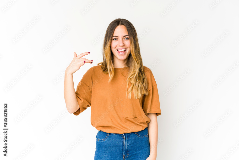 Young caucasian woman isolated on white background laughing about something, covering mouth with hands. Young caucasian woman isolated on white background laughing about something, covering mouth with hands.