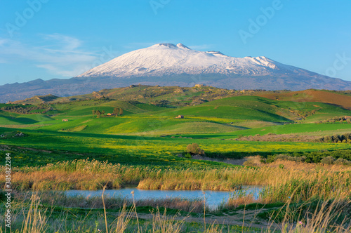 Hill Grass Land Landscape In Sicily On Background Etna Mount A Natural Landmark Of Unesco (view From The Southern Side)